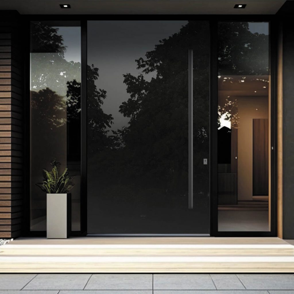 Glossy black pivot front door with side glass panels in modern entryway