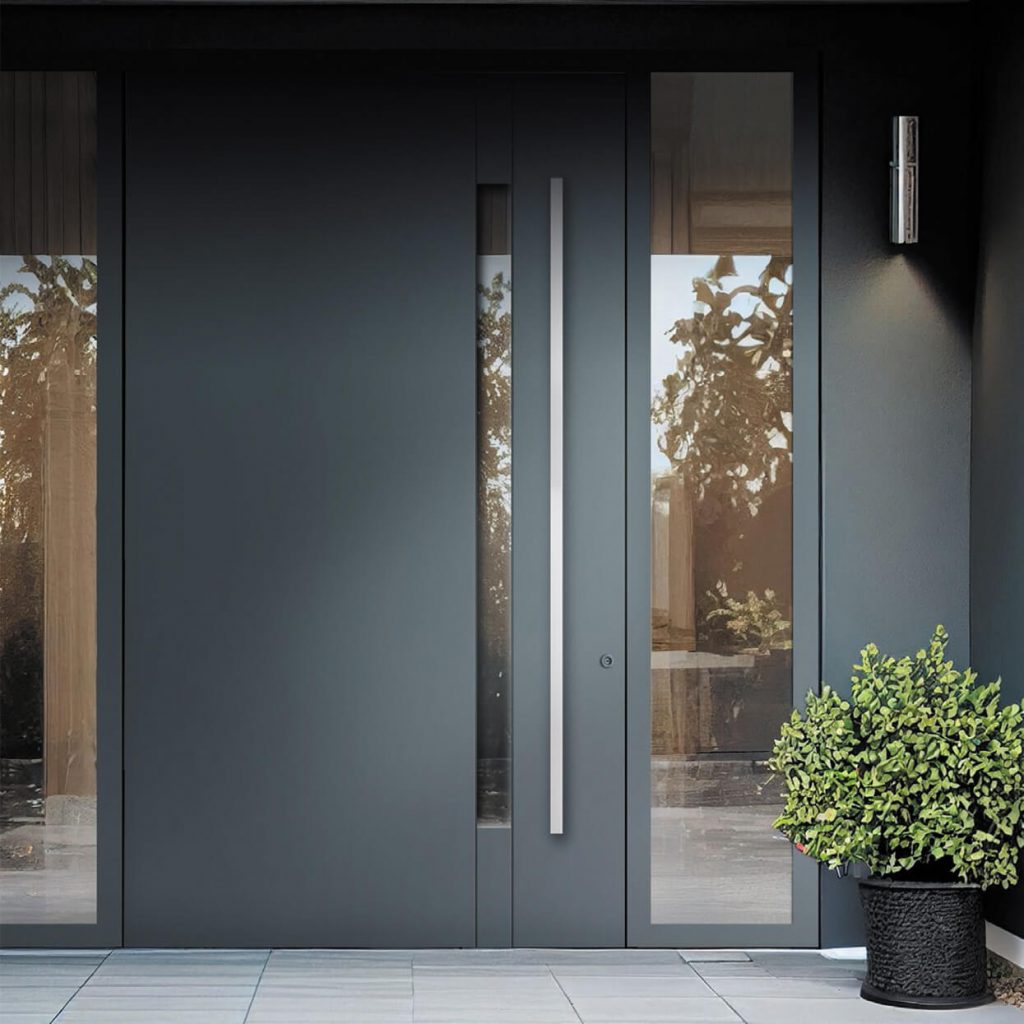Dark grey modern front door with tall stainless steel pull handle and side glass panels